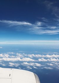 飛行機から見た空と雲のA4サイズ背景素材