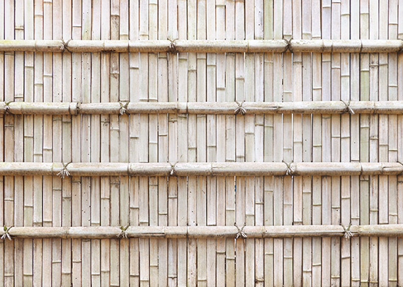 薄っすらオレンジ色の竹垣のA4サイズ背景素材